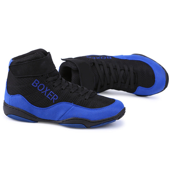 Red and black indoor training boxing shoes with mesh design and rubber sole.
