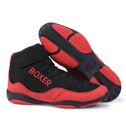 Red and black indoor training boxing shoes with mesh design and rubber sole.