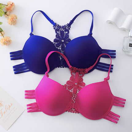 Fashionable push-up bras with buckle front and shaped back, displayed in blue and pink.
